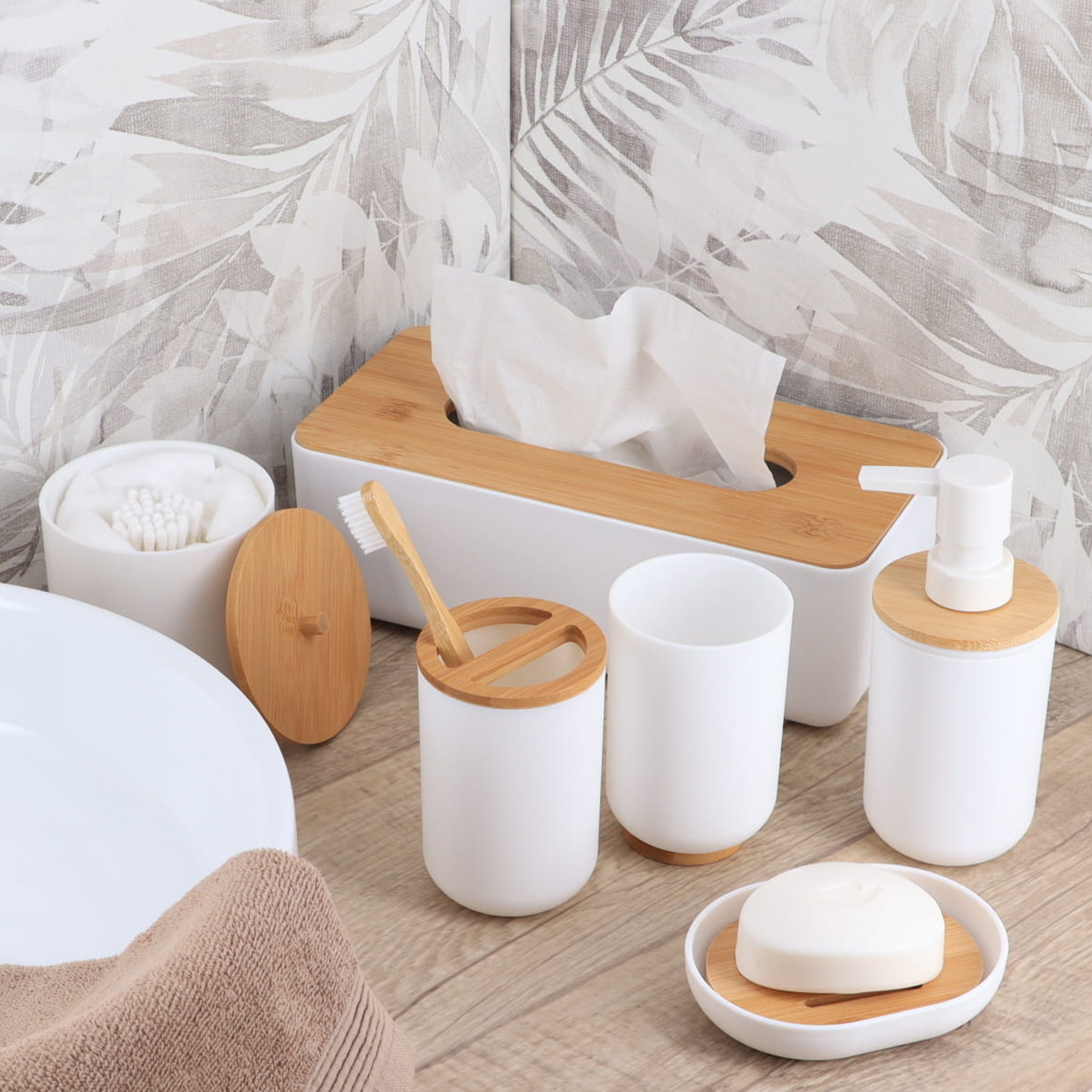 White and bamboo bathroom accessory set with soap dish on countertop