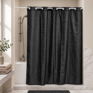 Black extra long hookless shower curtain hanging on a rod in a bright bathroom with a bathtub