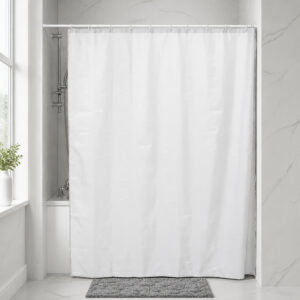 White polyester shower curtain installed across a bathtub in a hotel style bathroom