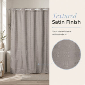 Close-up of the textured satin finish and cubic dotted weave on the taupe polyester shower curtain