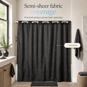 Semi-sheer black shower curtain giving privacy across a bathtub opening in a bright bathroom with a window