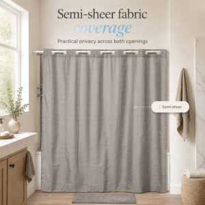 Semi-sheer taupe shower curtain giving privacy across a bathtub opening in a bright bathroom with a window