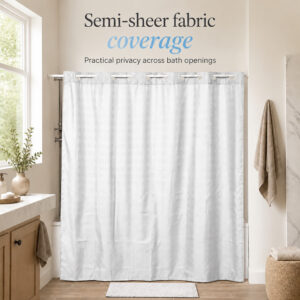 Semi-sheer white shower curtain letting daylight through while giving privacy across a bathtub opening