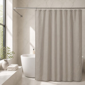 Taupe polyester shower curtain installed across a bathtub in a hotel style bathroom