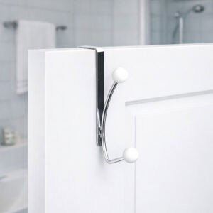 "Chrome double hook with white ball ends mounted on white bathroom door"