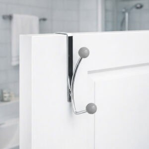 "Chrome double hook with gray ball ends mounted on white bathroom door"
