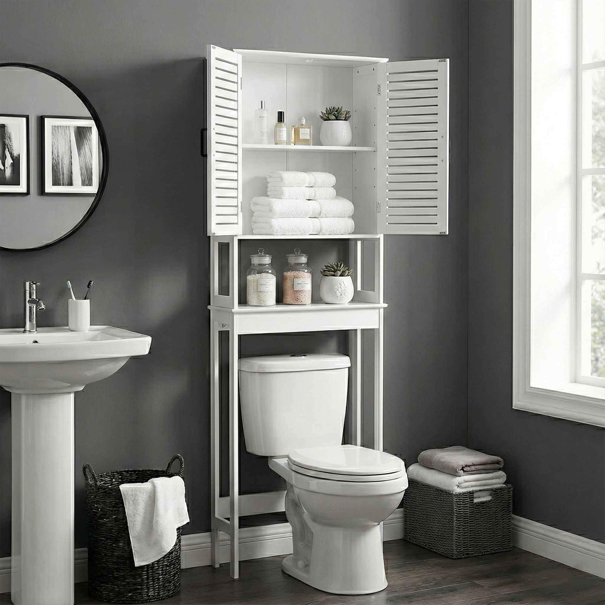 Front view of over-the-toilet white storage cabinet – A freestanding white cabinet with vented double doors and cut-out handles, designed to fit above a standard toilet for efficient storage.
