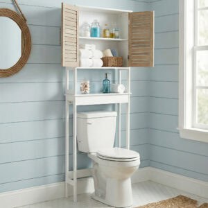 “White over-the-toilet cabinet with wood-look doors open in coastal light blue bathroom”