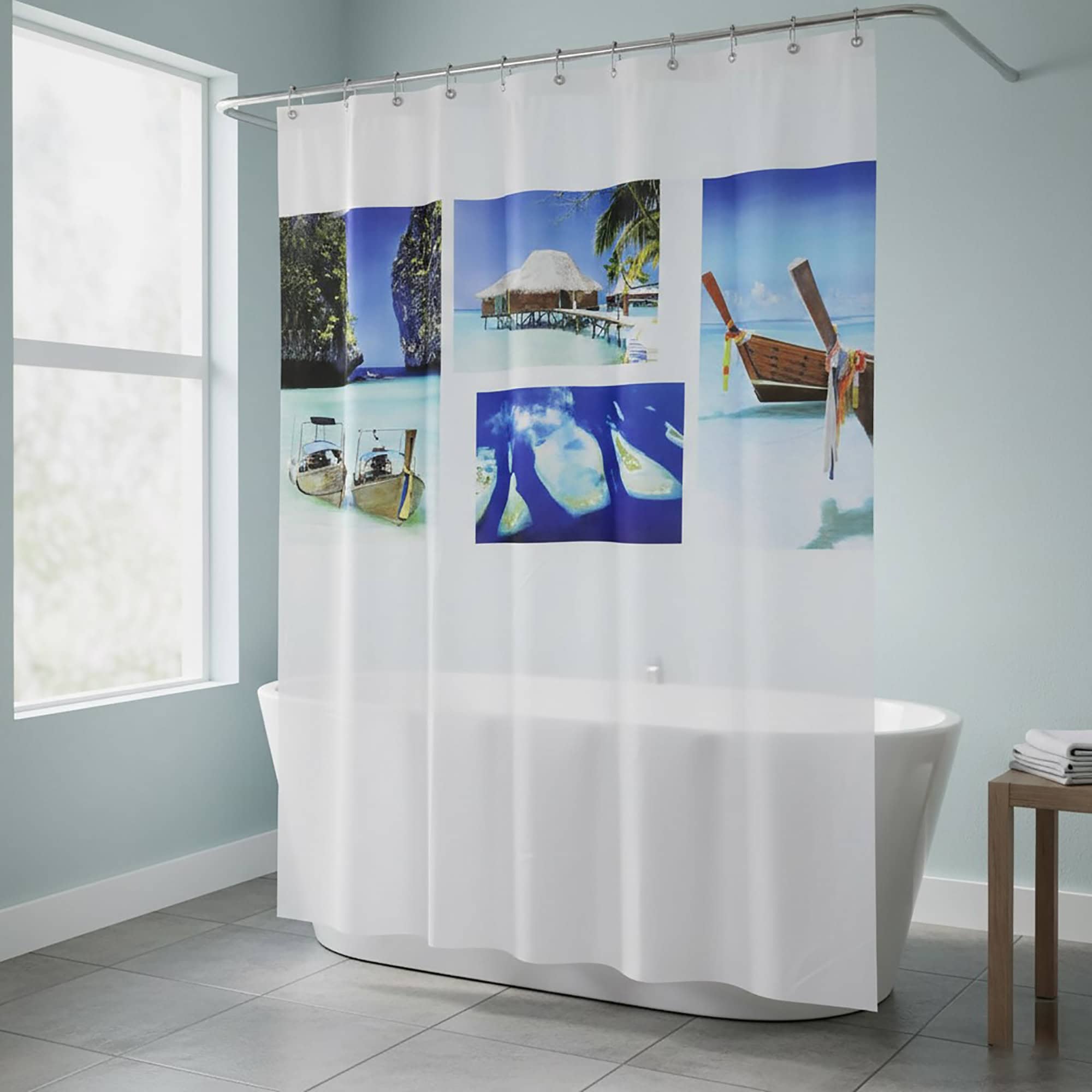 Tropical photo shower curtain hanging over white bathtub