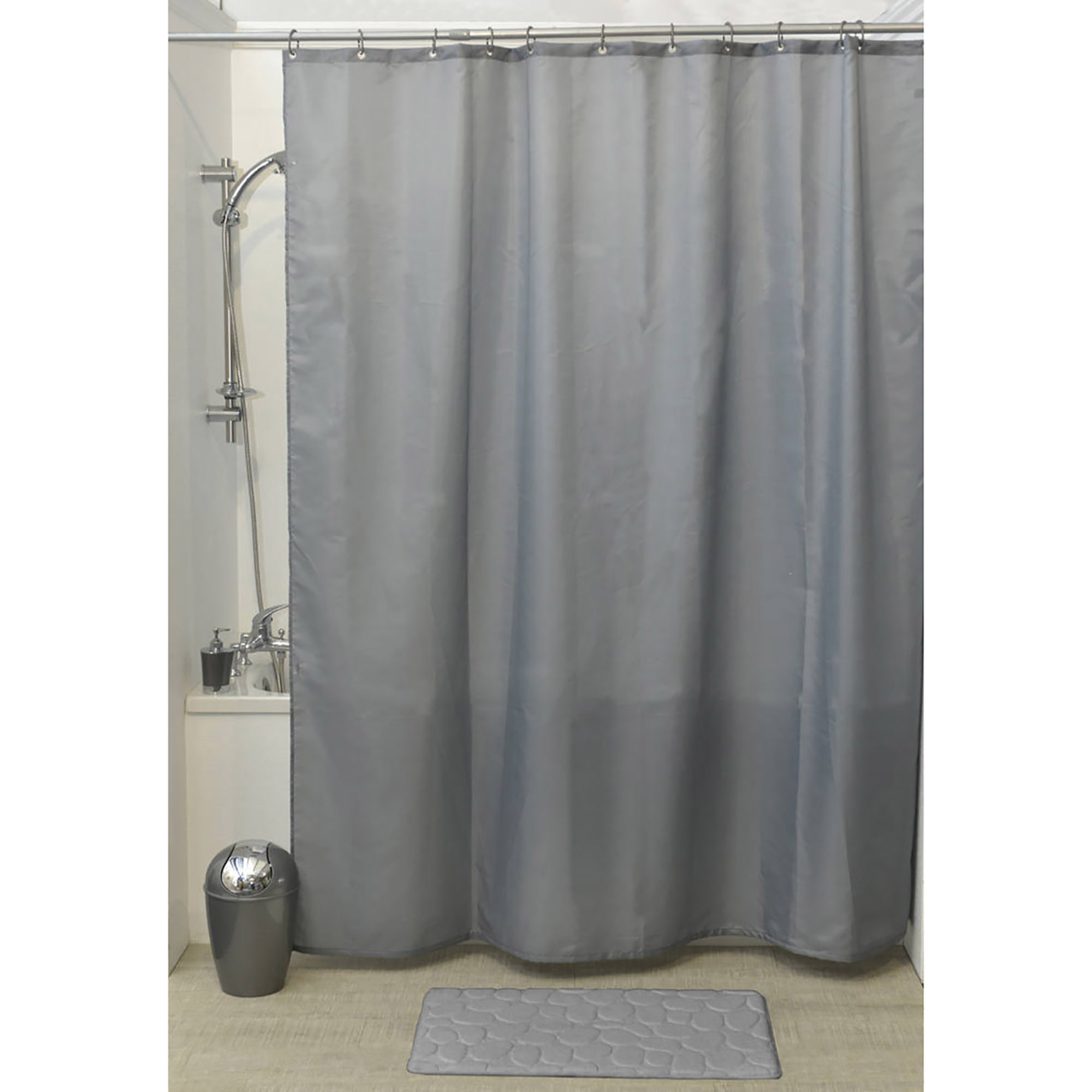 Gray shower curtain displayed in bathtub setup with matching mat