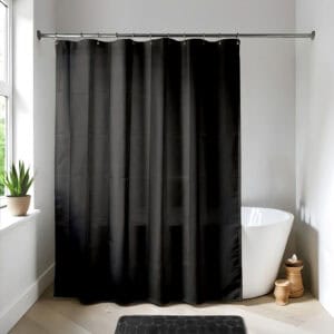 Black shower curtain in a bright modern bathroom