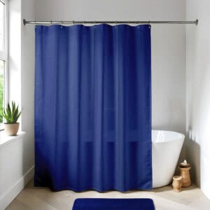 Navy blue shower curtain in a bright modern bathroom