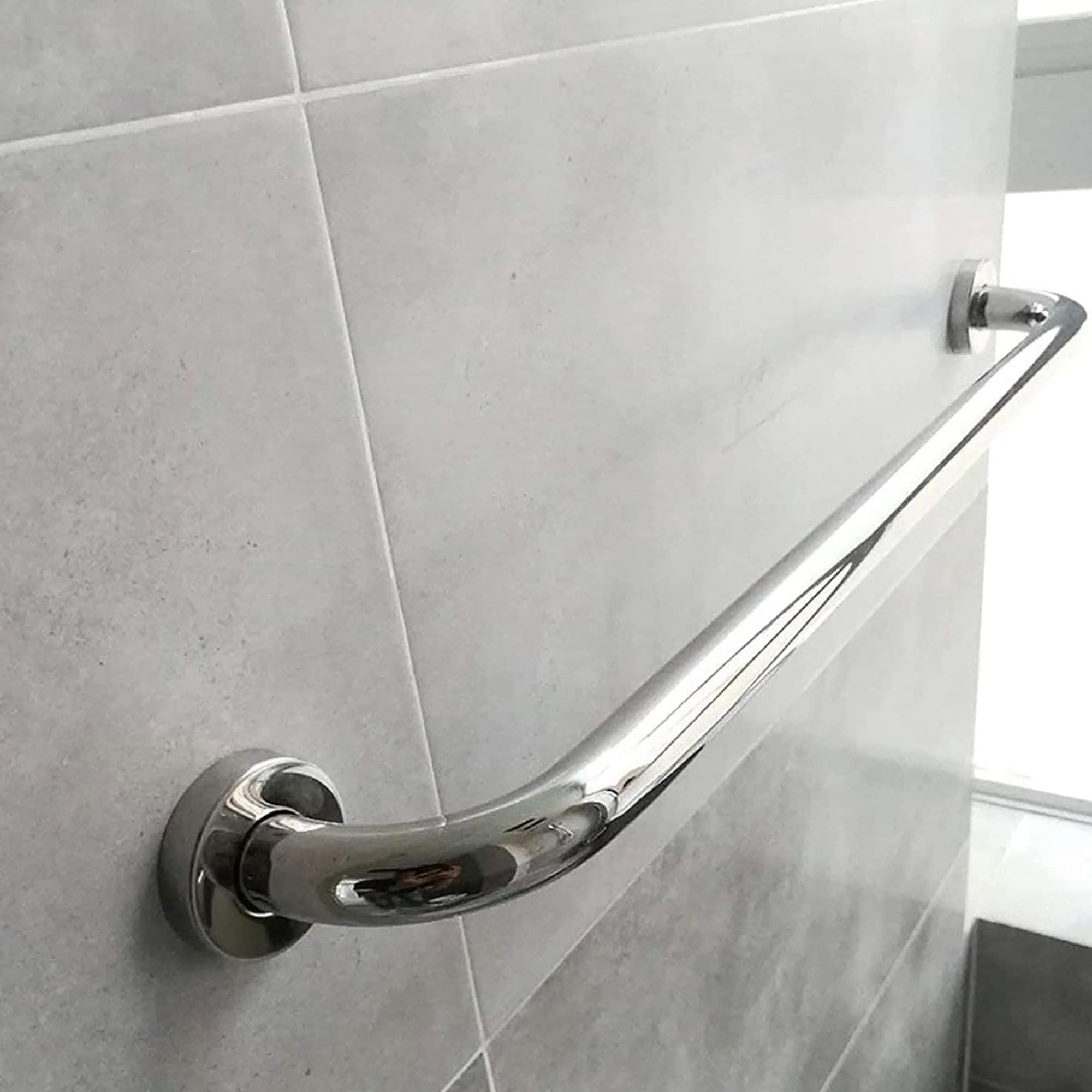 Long chrome grab bar mounted on a bathroom wall, offering modern support and stability.