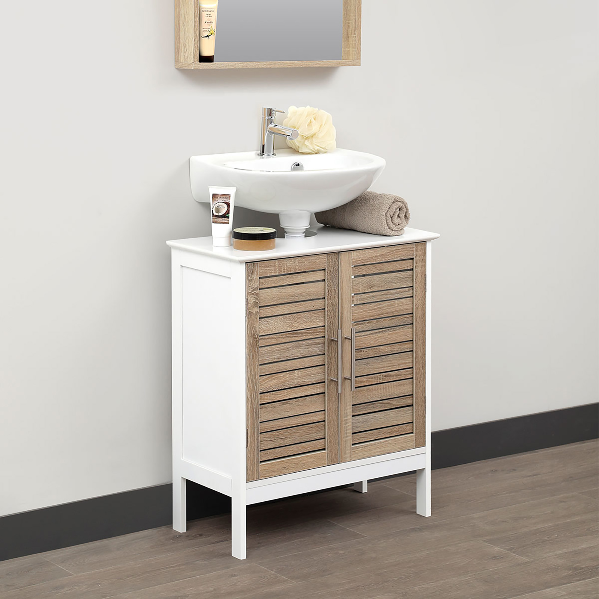 Bathroom under-sink cabinet styled with a sink: A compact under-sink bathroom cabinet topped with a modern vessel sink, surrounded by decorative bathroom essentials.