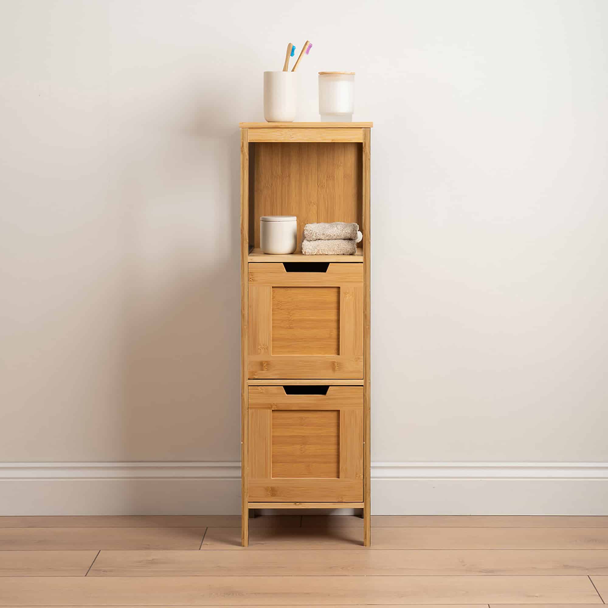 Bamboo Cabinet Styled with Bathroom Accessories - The bamboo storage cabinet displayed in a bathroom setting, decorated with towels and toiletries, showcasing its functionality and aesthetic appeal.