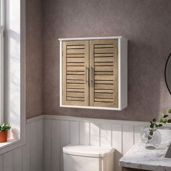 "White and oak double-door louvered wall cabinet mounted above a toilet in a grey panelled bathroom"