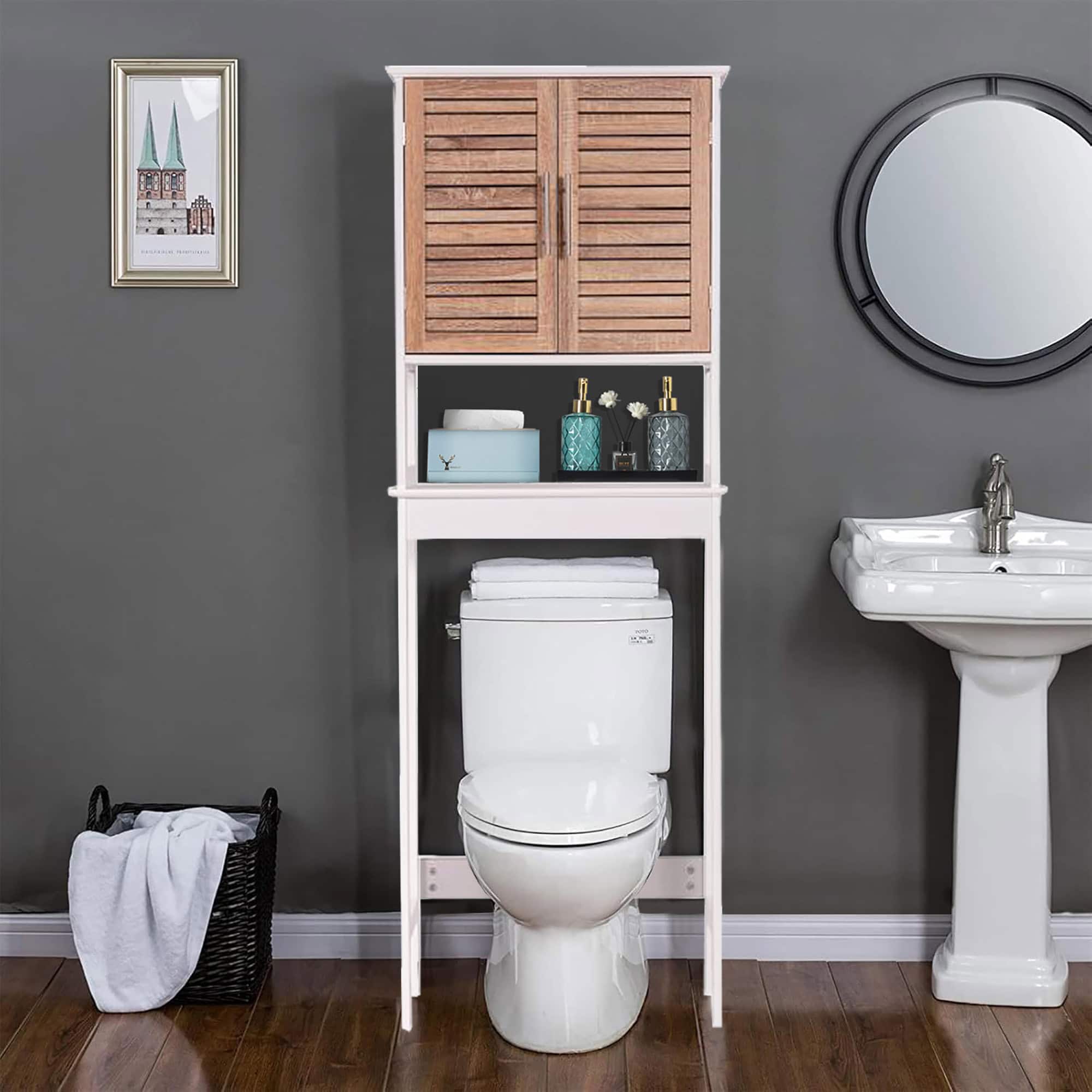 Front view of an over-the-toilet storage cabinet in white with wood-look vented doors and stainless steel handles.