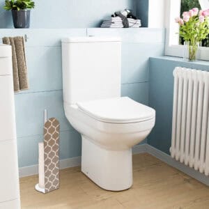 Beige geometric-pattern toilet paper holder placed beside modern white toilet in bright blue bathroom