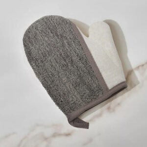 Close-up of dual-textured mitt showing gray and white textured surfaces
