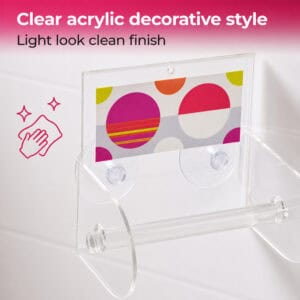 Eclats clear acrylic toilet paper holder close-up showing suction cups and roll bar. "Clear acrylic decorative style" / "Light look clean finish" with a wipe-clean icon.