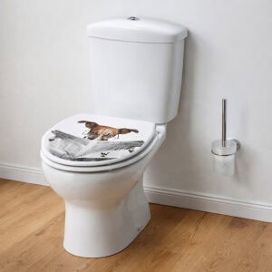 Side view of white toilet with elongated dog print toilet seat closed