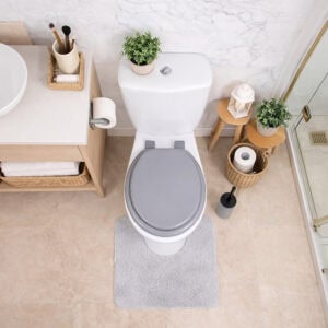 Gray round toilet seat installed on toilet top view