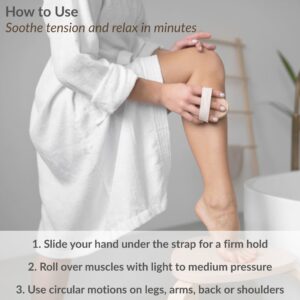 Woman using massage brush on her leg in bathrobe with usage instructions