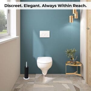 White toilet paper holder placed in a stylish bathroom next to a wall-mounted toilet