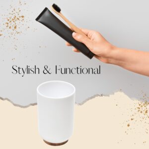 White tumbler cup with toothbrush and toothpaste graphic