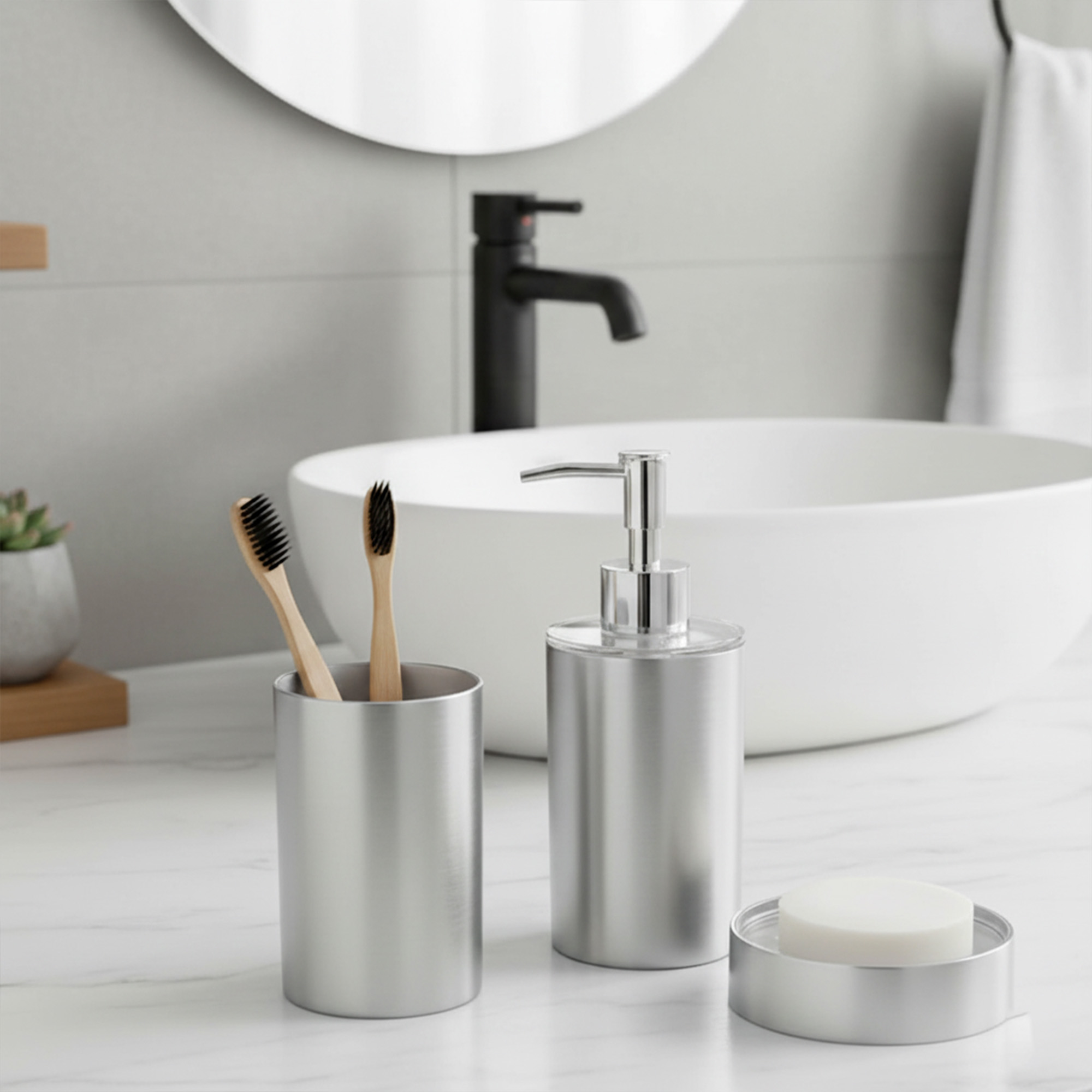 Brushed aluminum tumbler with matching soap dispenser on modern vanity