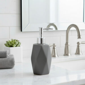 Matte gray soap dispenser on marble bathroom counter
