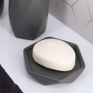 Grey soap dish with bar soap close up