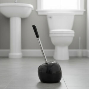 Black round toilet brush holder with stainless steel handle and black top in modern bathroom