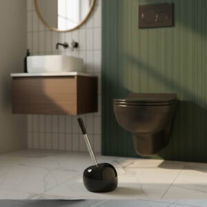 Black spherical toilet brush holder with stainless steel handle in contemporary bathroom with green wall