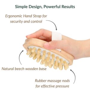 Hand holding massage brush showing ergonomic strap, wooden base, and rubber nodules