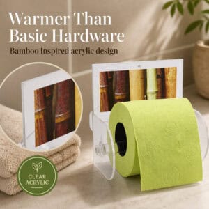 Bamboo clear acrylic toilet paper holder on a counter holding a lime-green roll, with a close-up of the bamboo graphic insert. "Warmer Than Basic Hardware" / "Bamboo inspired acrylic design", with a "CLEAR ACRYLIC" leaf badge.
