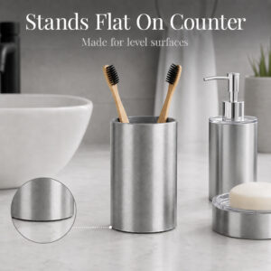 Brushed aluminum bath tumbler cup holder Noumea with flat base standing on a counter