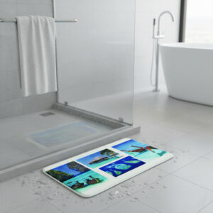 Paradise print bath mat featuring tropical beach scenes on wet bathroom floor near glass shower