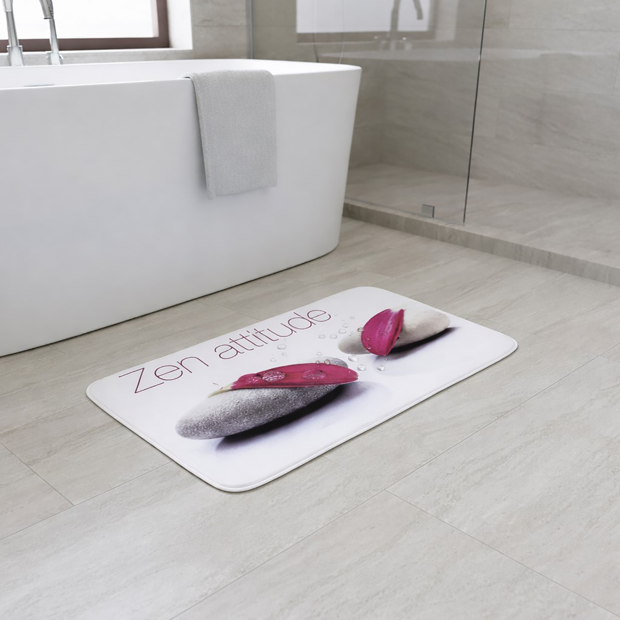 "'Zen attitude' memory foam bath mat displayed beside freestanding tub in modern bathroom"