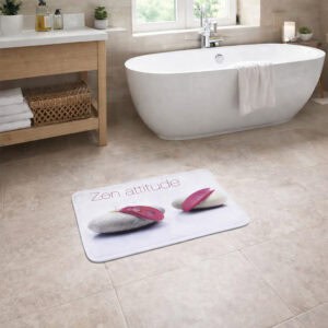 "'Zen attitude' memory foam bath mat on tile floor beside freestanding soaking tub"