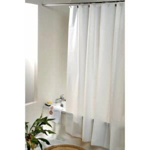 White curtain in a cozy bathroom with bathtub