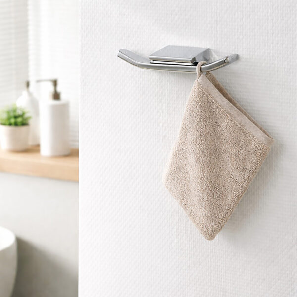 "Chrome double wall hook with washcloth hanging in modern bathroom"