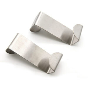 "Two brushed stainless steel over-the-door hooks on white background"