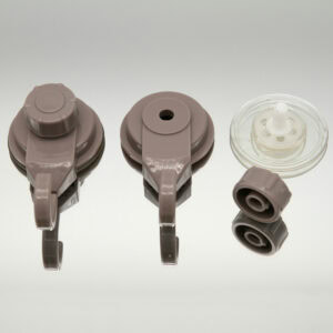 Tan suction cup hook disassembled showing three components: hook unit, base, and clear suction cup