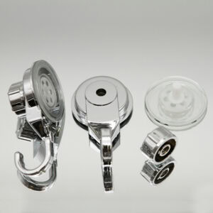 Chrome suction cup hook disassembled showing three components: hook unit, base, and clear suction cup