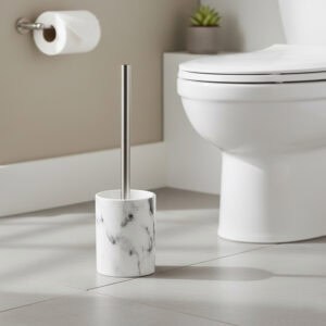 White marble effect toilet brush holder with stainless steel handle beside white toilet in modern bathroom