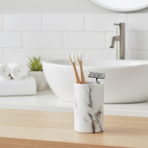 Marble effect tumbler used as toothbrush and razor holder