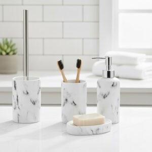 Marble bathroom set on countertop with toothbrushes, soap dish, and dispenser