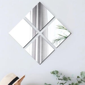 "Four square frameless mirrors arranged in a diamond pattern on a light blue wall"