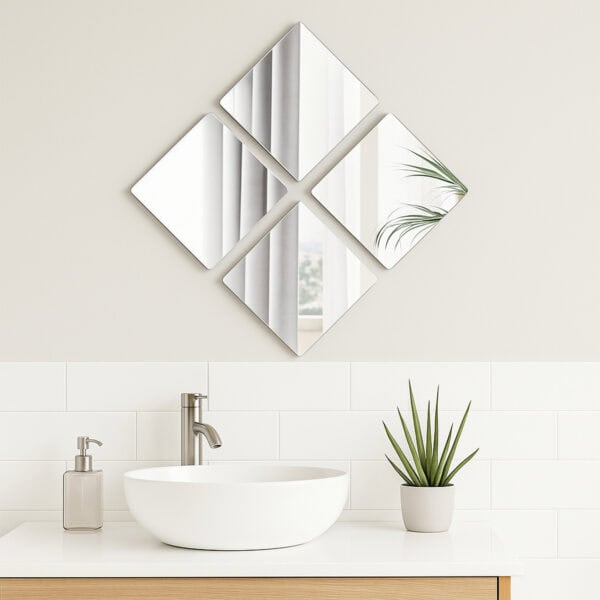 "Four square mirrors in diamond arrangement above a white vessel sink in a modern bathroom"